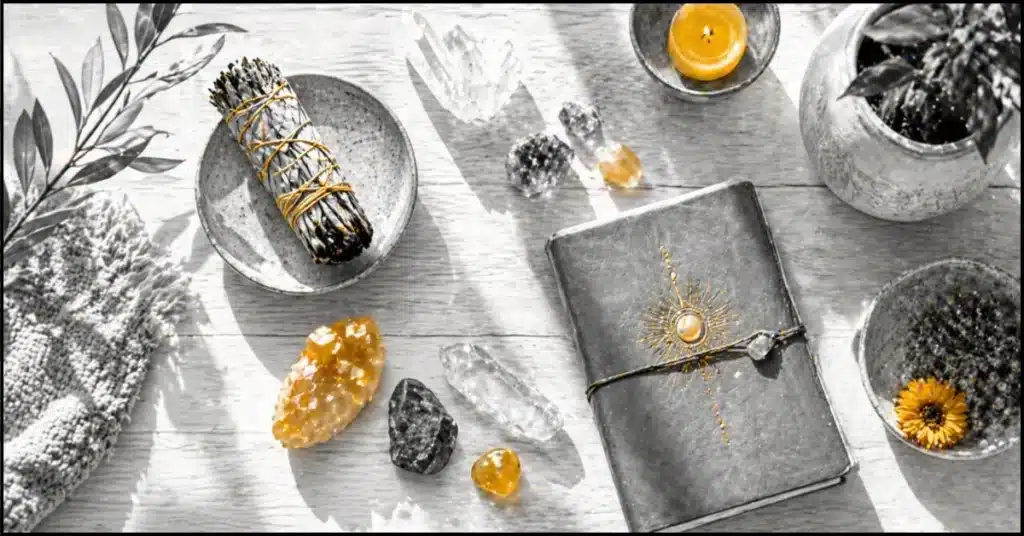 "Chakra healing tools including crystals, sage, and journal for daily energy balancing ritual"